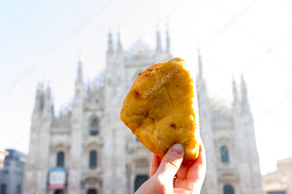 Panzerotti in front of the Duomo in Milan