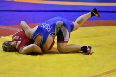 Orenburg, Russia - October 25, 2017 year: Girls compete in freestyle wrestling   clipart