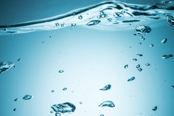 Water surface with ripple and bubble