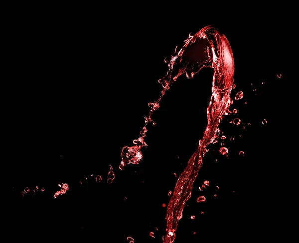 Red splash on a black — Stock Photo, Image