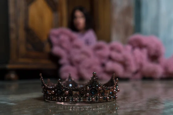 Crown With Beautiful Woman on Background. Concept Of Destroying Human ego, Self Assurance, Taking Off The Crown. Self-satisfaction Self-Admiration, Narcissism, Confident Personality. Vanity, Conceit