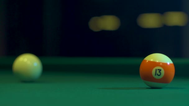 Colorful billiard balls on billiard table roll different directions. Macro shot — Wideo stockowe