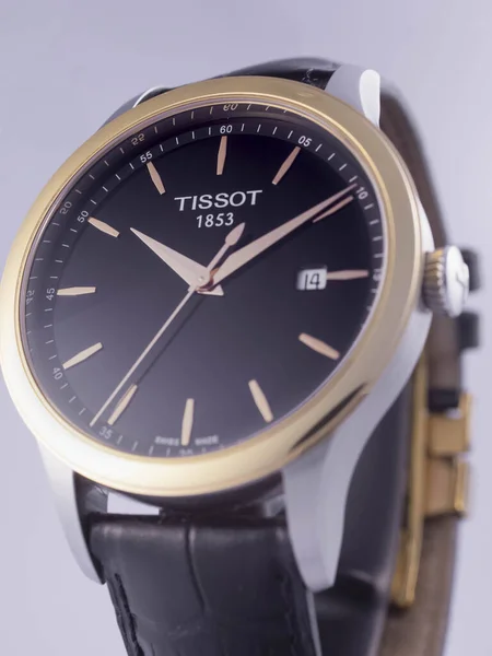 Le Locle, Швейцарія 15.01.2020 - Tissot man watch less steel case, gold PVD coating black clock face dial, ather strap, swiss quartz meticical watch isolated, swiss made production — стокове фото