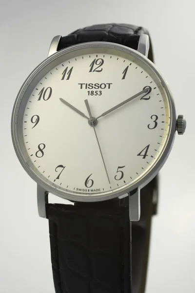 Le Locle, Швейцарія 15.01.2020 - Tissot man watch less steel case, white clock face dial, ather strap, swiss quartz techantic watch isolated, swiss made production — стокове фото