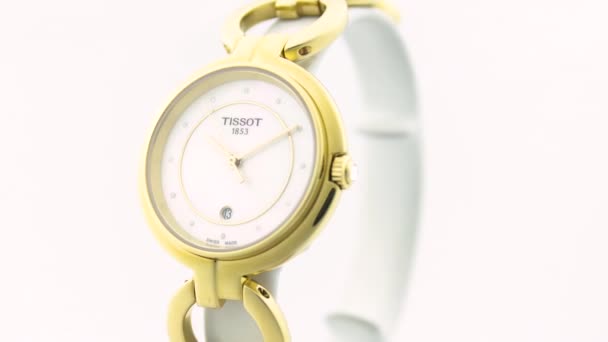 Le Locle, Switzerland 15.01.2020 - Tissot woman watch stainless steel case, gold PVD coating white clock face dial, metal bracelet, swiss quartz mechanical watch isolated, swiss made manufacture — Stock Video