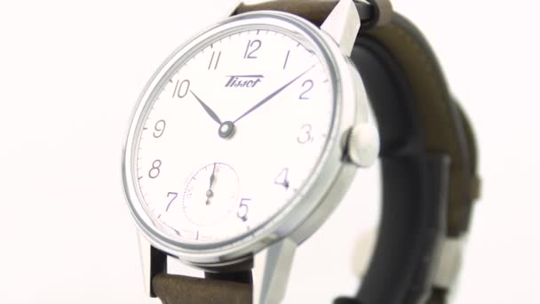 Le Locle, Switzerland 15.01.2020 - Tissot man watch stainless steel case, white clock face dial, leather strap, swiss quartz mechanical watch isolated, swiss made manufacture — Stock Video