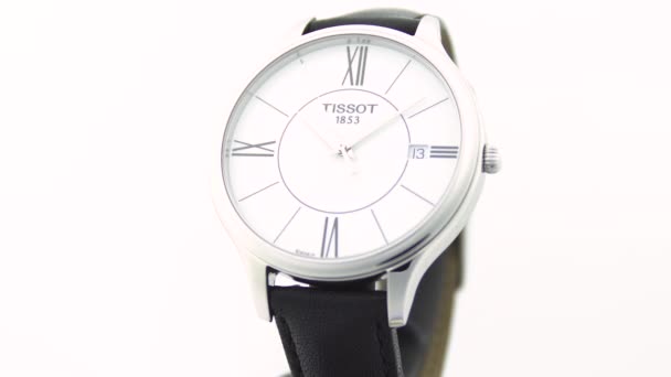 Le Locle, Switzerland 15.01.2020 - Tissot man watch stainless steel case, white clock face dial, leather strap, swiss quartz mechanical watch isolated, swiss made manufacture — Stock Video