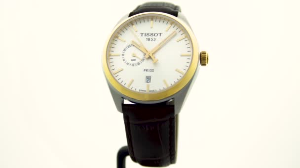 Le Locle, Switzerland 15.01.2020 - Tissot woman watch stainless steel case, gold PVD coating white clock face dial, leather strap, swiss quartz mechanical watch isolated, swiss made manufacture — Stock Video