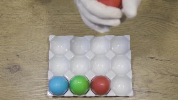 Decorated easter eggs in white tray. Happy Easter inspiration concept. Top view — Stock Video