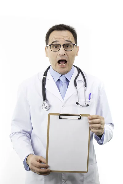 Shocked doctor showing clipboard with blank paper. Medical news, clinic ads — Stock Photo, Image