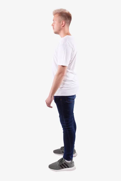 Full length man stands sideways to camera, looks forward. White background — Stock Photo, Image