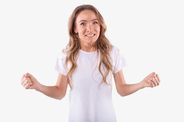 Young woman vehemently worried. Hands clenched into fists, teeth clenched. Win — Stock Photo, Image