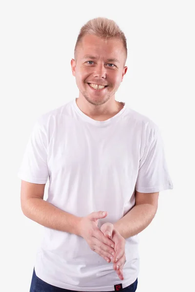 Agradável olhar sorrisos alegremente, esfrega as mãos. Fundo branco. Emoções — Fotografia de Stock