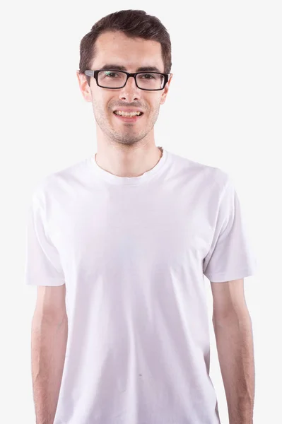 Young man with glasses in casual white t-shirt smiling. White background — Stock Photo, Image