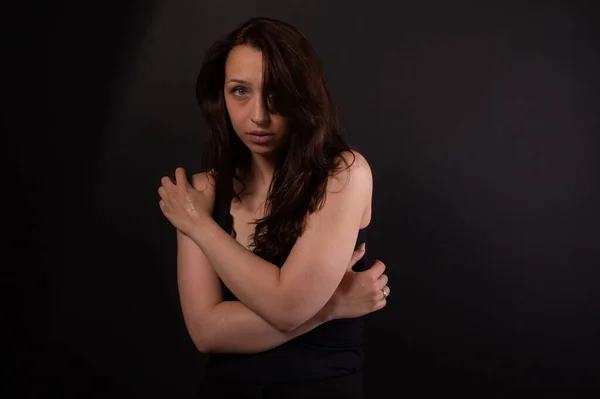 Caucasian girl in shy pose looks from under forehead. Harassment, me too concept — Stock Photo, Image