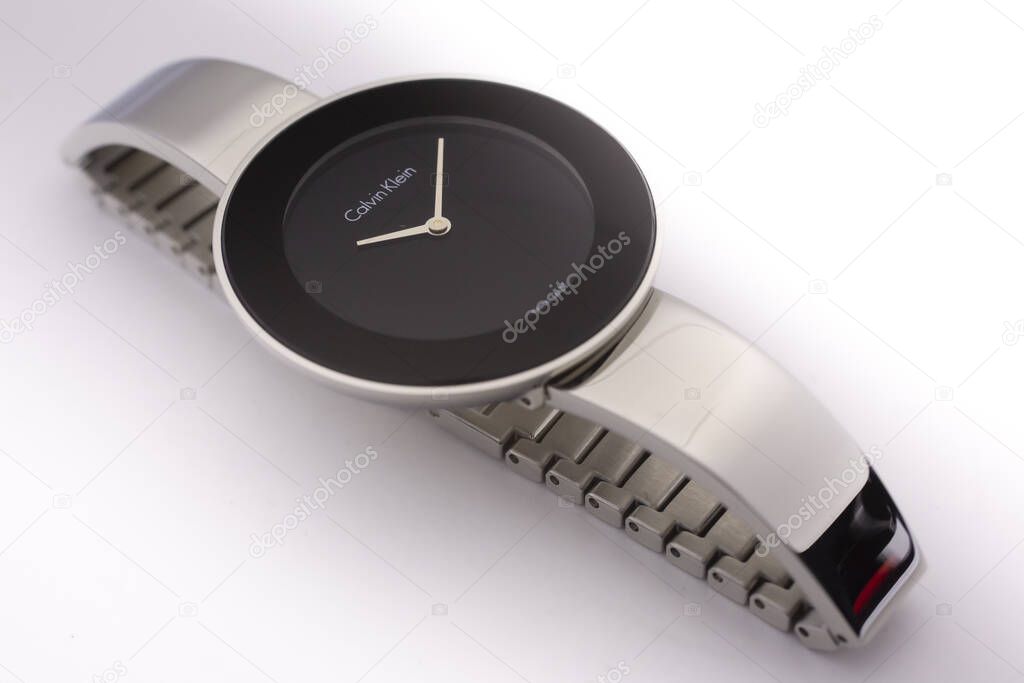 Biel, Switzerland 31.03.2020 - The closeup of CALVIN KLEIN woman watch stainless steel case stainless steel bracelet swiss quartz watch swiss made manufacture isolated lying on table .