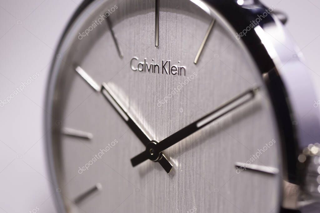 Biel, Switzerland 31.03.2020 - The closeup of CALVIN KLEIN man white clock face dial swiss quartz watch swiss made manufacture isolated .