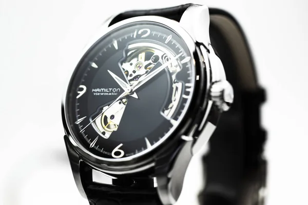 Biel, Switzerland 31.03.2020 - The close of Hamilton man watch stainless steel case black clock face dial leather strap swiss quartz Machine watch isolated on stand swiss made manufactory — 스톡 사진