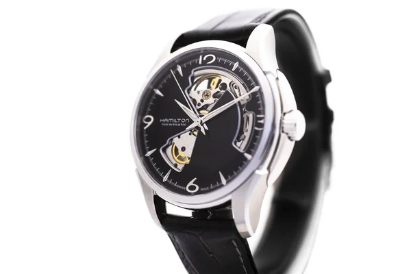 Biel, Switzerland 31.03.2020 - The close up of Hamilton man watch stainless steel case black clock face dial leather strap swiss quartz mechanical watch isolated on stand swiss made manufacture — Stock Photo, Image