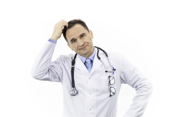 Middle-aged handsome doctor looking frustrated, scratches head with his hand — Stock Photo, Image