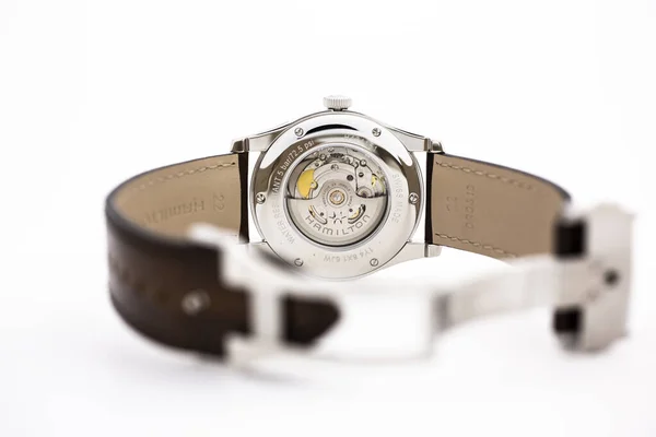 Biel, Switzerland 31.03.2020 - The close of Hamilton man watch stainless steel case back case leather strap swiss quartz Machine watch isolated lying on table swiss made manufactory — 스톡 사진