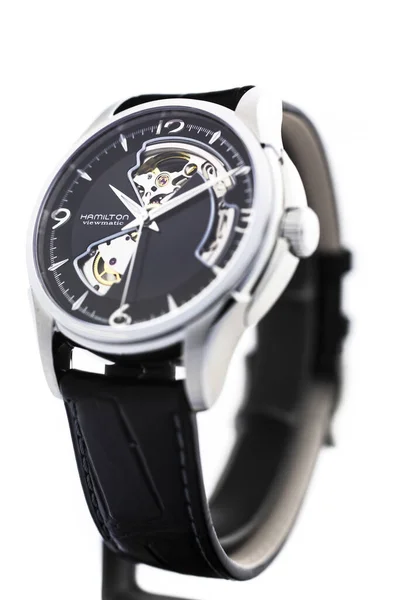 Biel, Switzerland 31.03.2020 - The close up of Hamilton man watch stainless steel case black clock face dial leather strap swiss quartz mechanical watch isolated on stand swiss made manufacture — Stock Photo, Image
