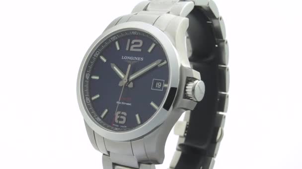 Saint-Imier, Switzerland, 2.02.2020 - Longines watch black clock face dial stainless steel bracelet. классические элегантные швейцарские часы — стоковое видео