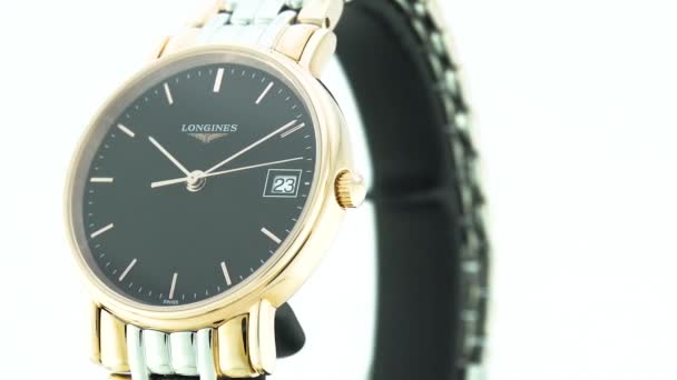 Saint-Imier, Switzerland, 2.02.2020 - Longines watch black clock face dial close up stainless steel bracelet. классические элегантные швейцарские часы — стоковое видео