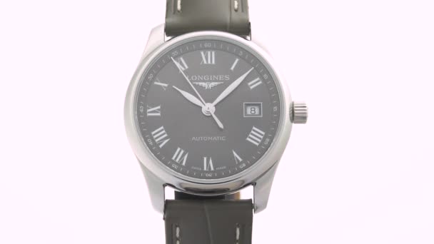 Saint-Imier, Switzerland, 2.02.2020 - Longines watch black clock face dial leather strap. классические элегантные швейцарские часы — стоковое видео