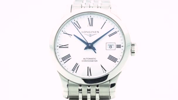 Saint-Imier, Switzerland, 2.02.2020 - Longines watch white clock face dial close up stainless steel bracelet. классические элегантные швейцарские часы — стоковое видео