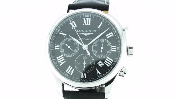 Saint-Imier, Switzerland, 2.02.2020 - Longines watch black clock face dial close up leather strap. классические элегантные швейцарские часы — стоковое видео