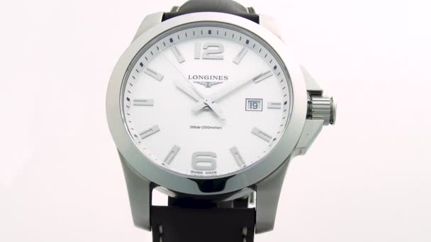 Saint-Imier, Switzerland, 2.02.2020 - Longines watch white clock face dial leather strap. классические элегантные швейцарские часы — стоковое видео