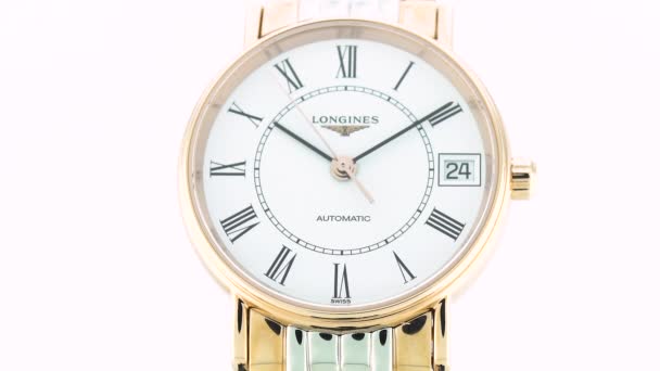 Saint-Imier, Switzerland, 2.02.2020 - Longines watch white clock face dial close up stainless steel bracelet. классические элегантные швейцарские часы — стоковое видео