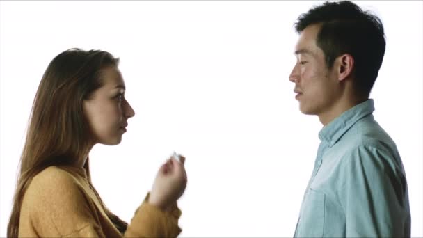 Caucasian woman and asian man wearing medical masks. Virus protection concept — Stock Video