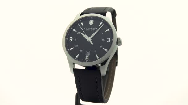Ibach, Switzerland 7.04.2020 - Victorinox Man watch stainless steel case black clock face dial isolated on white background — 图库视频影像