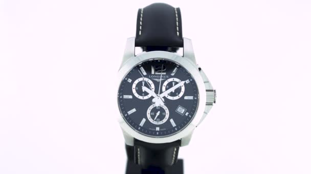 Saint-Imier, Switzerland, 2.02.2020 - Longines watch black clock face dial leather strap — Stock Video