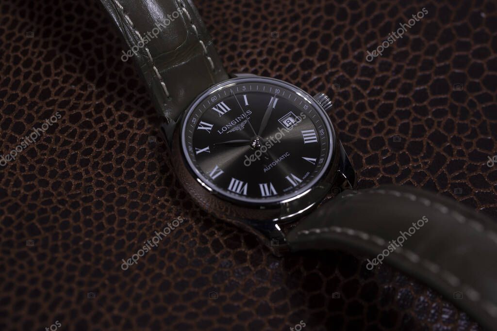 Saint-Imier, Switzerland 31.03.2020 - Closeup image of Longines watch stainless steel case black clock face dial leather strap swiss quartz mechanical watch swiss made manufacture .