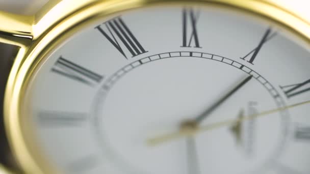Saint-Imier, Switzerland, 2.02.2020 - Longines golden watch white clock face dial macro selective focus. классические элегантные швейцарские часы — стоковое видео