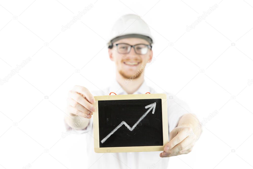 cocky, satisfied businessman holds upward trend graph smiling looks at camera