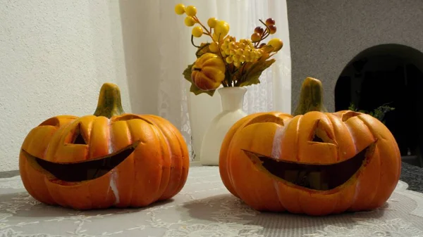 Halloween ceramical pumpkins have a creepy smile.