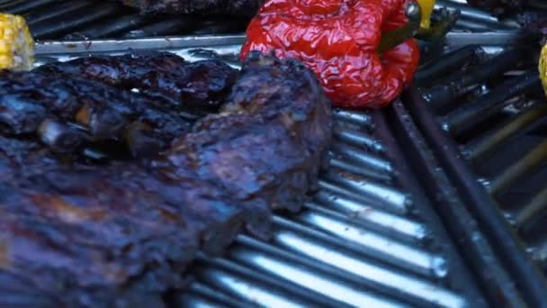 Lamb Ribs and Vegetables on a Rotating Grill, meat and corn on a barbecue, slow motion — Stock Video