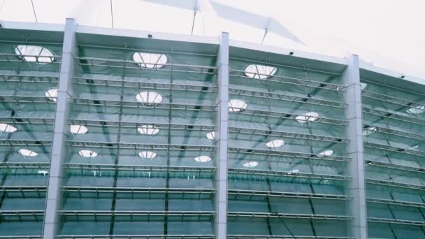 Washing windows with a brush with a long handle, cleaning glass surfaces in the stadium — Stock Video