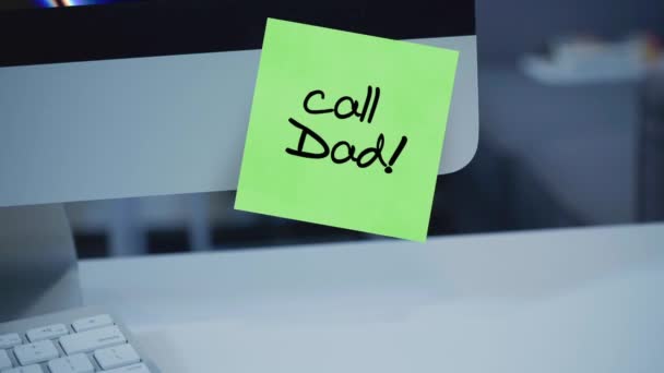 Call dad. Sticker with a reminder of the call dad. Video call. Communication with parents during quarantine. Isolation. The inscription on the sticker on the monitor. Message. Motivation. Reminder. 