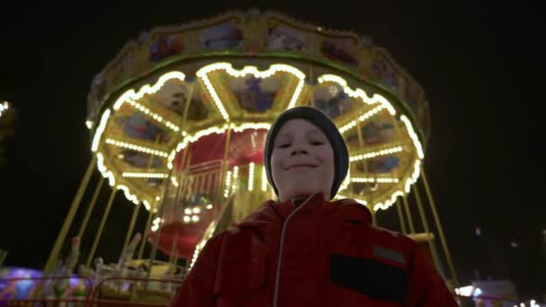 Boy Stands Spinning Carousel Front View Child Whirling Merry Amusement — Stock Video