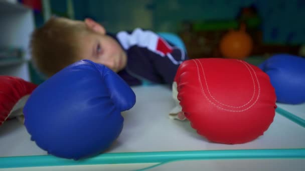 Upset Child Looks Out Window Quarantine Sad Boy Boxing Gloves — Stock Video