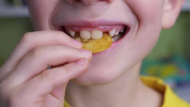 Child Puts Potato Chips His Mouth Young Caucasian Kid Eating — Stock Video