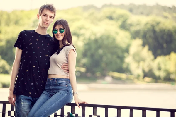Gorgeous couple in the park posing on lake background — Stock Photo, Image