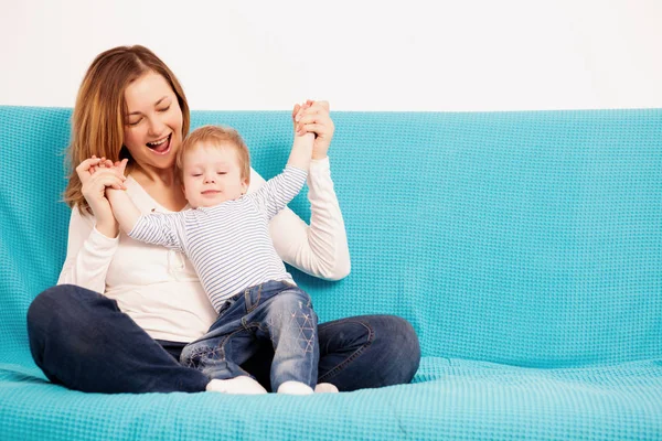 Smiling mother and child son having fun time toghether Royalty Free Stock Photos