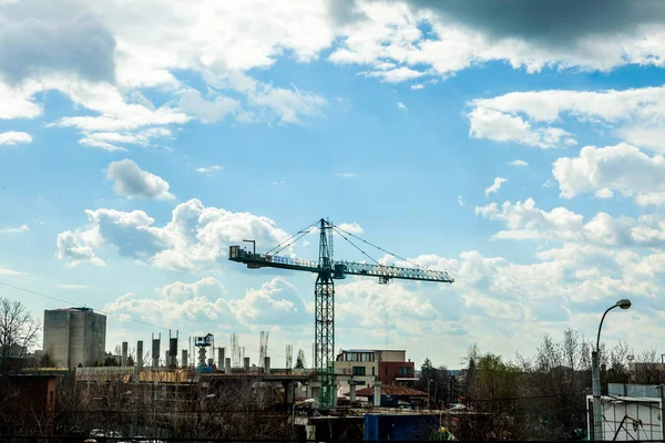 Clouds Over A Construction Yard with a crane