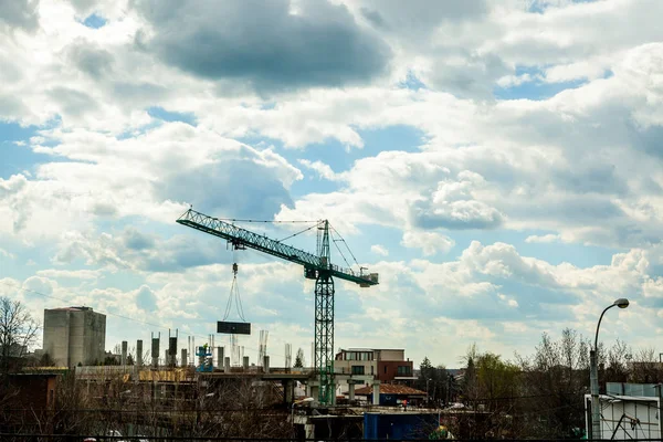 Crane on industrial construction yard in city